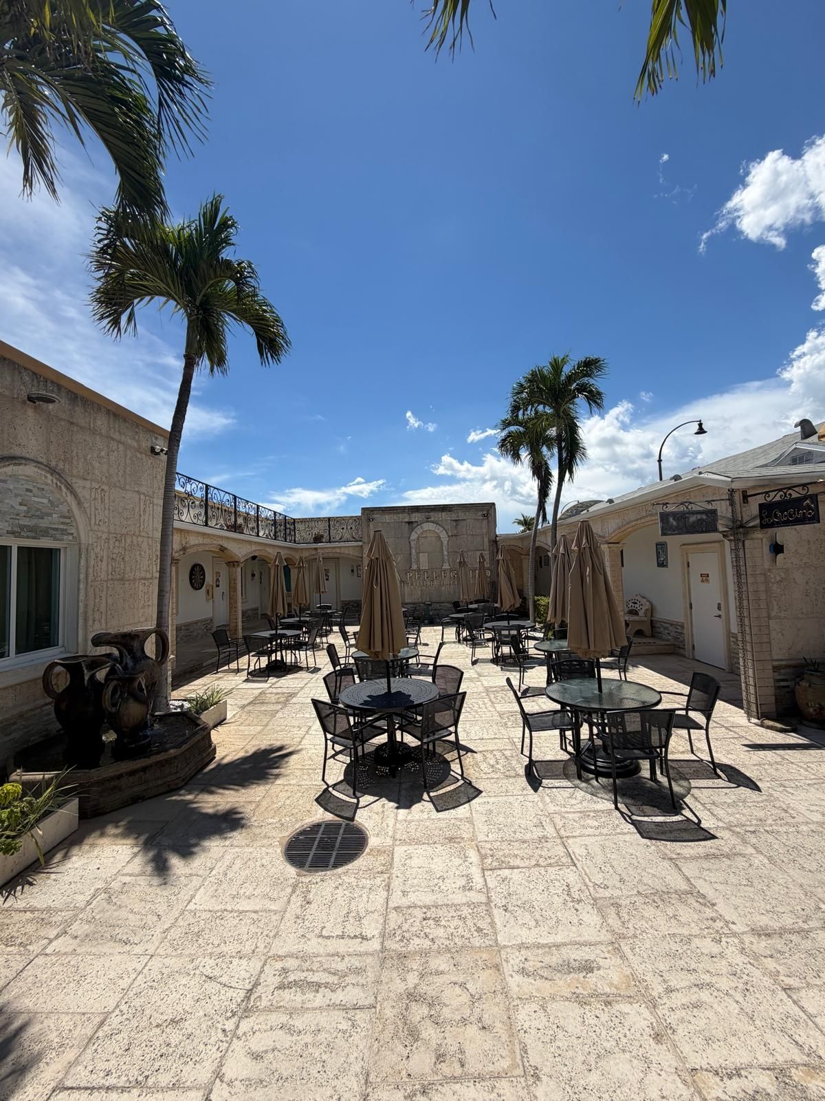 Tables under the palms at Hollywood Beach Hotels